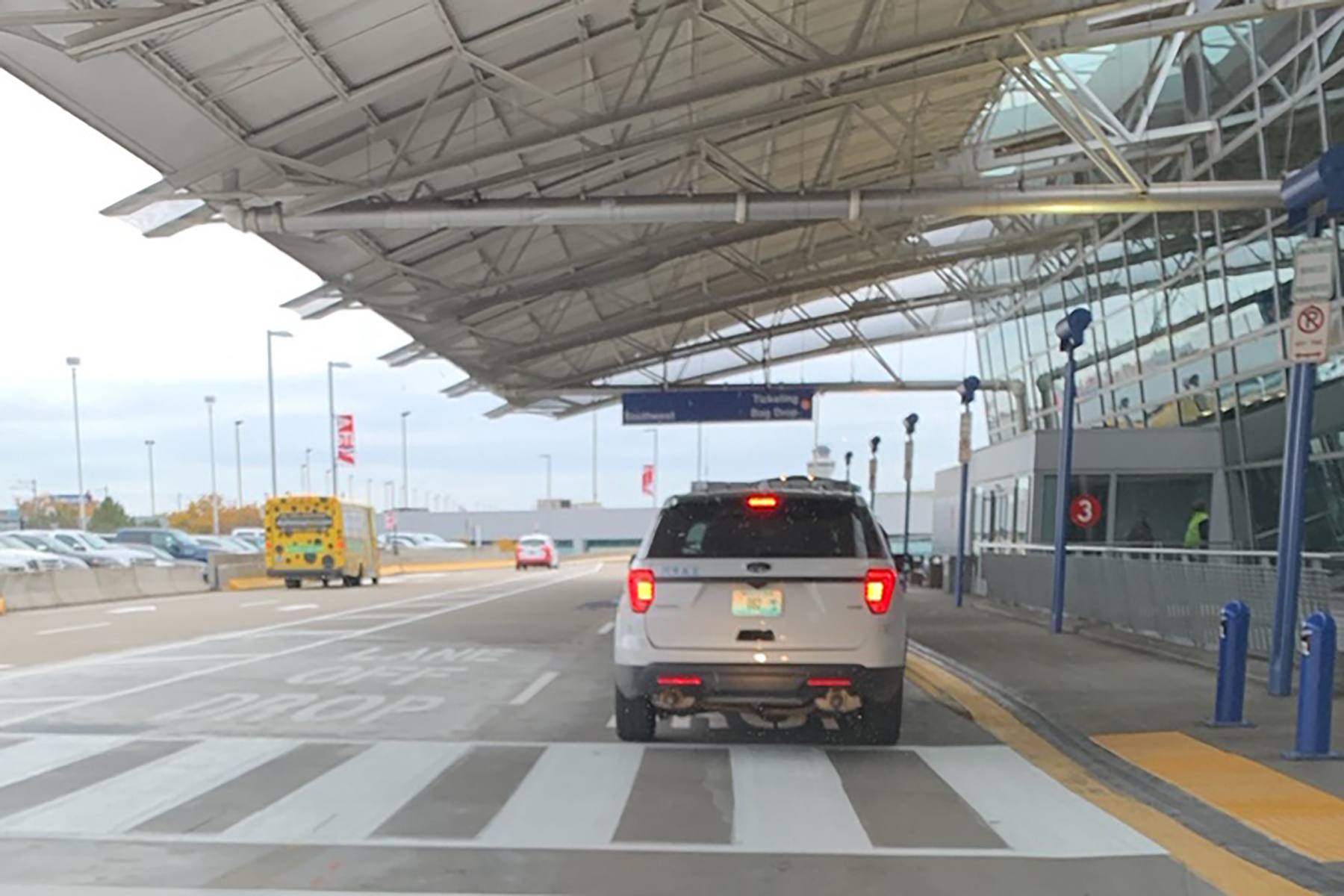 Two new parallel lanes for drop-off, instead of angled pull-thru parking spots.