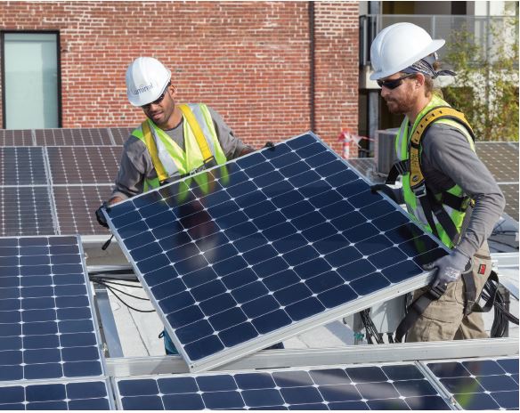 workers installing solar panels