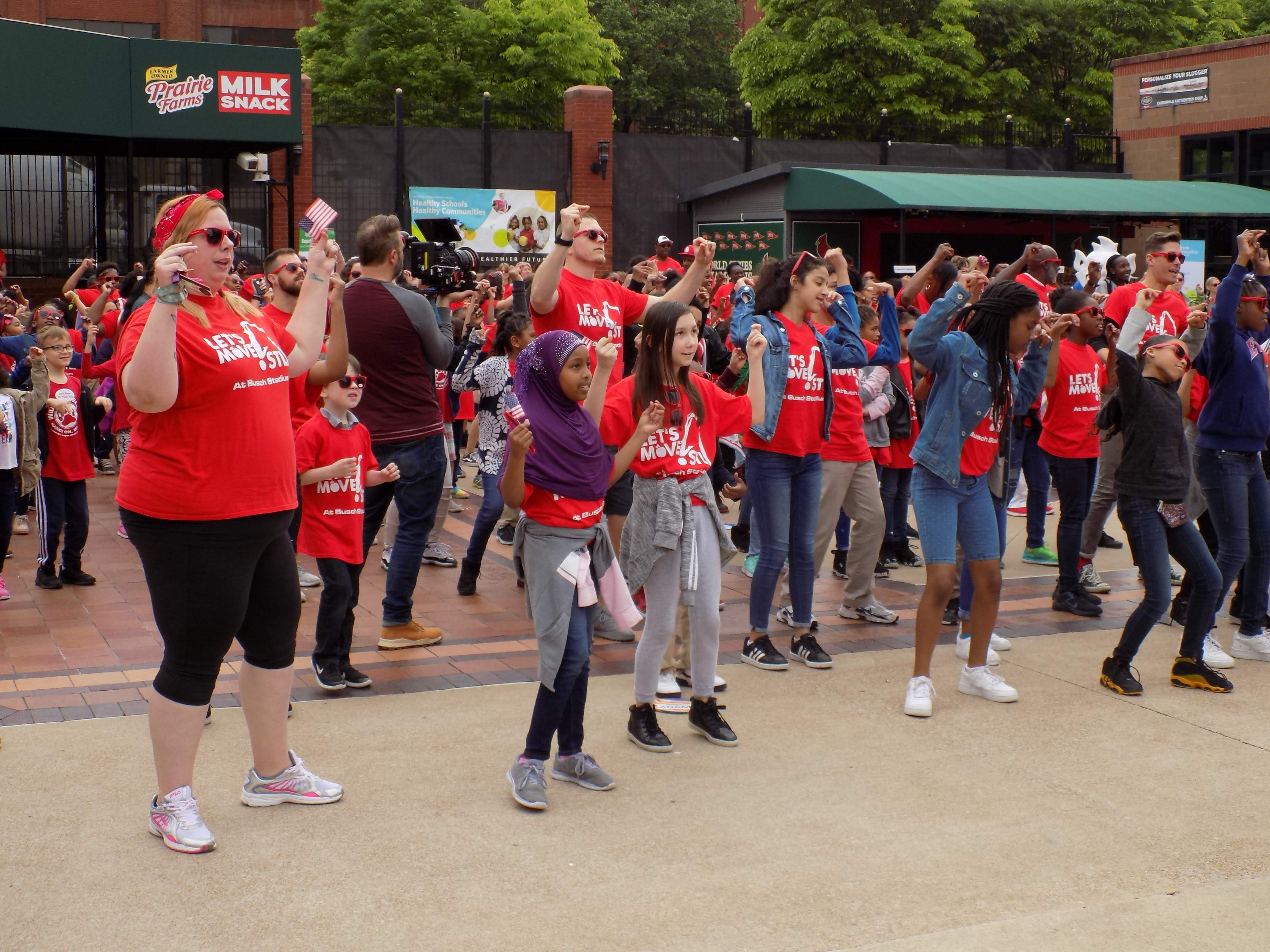 Students and adults dance to the Flash Mob music