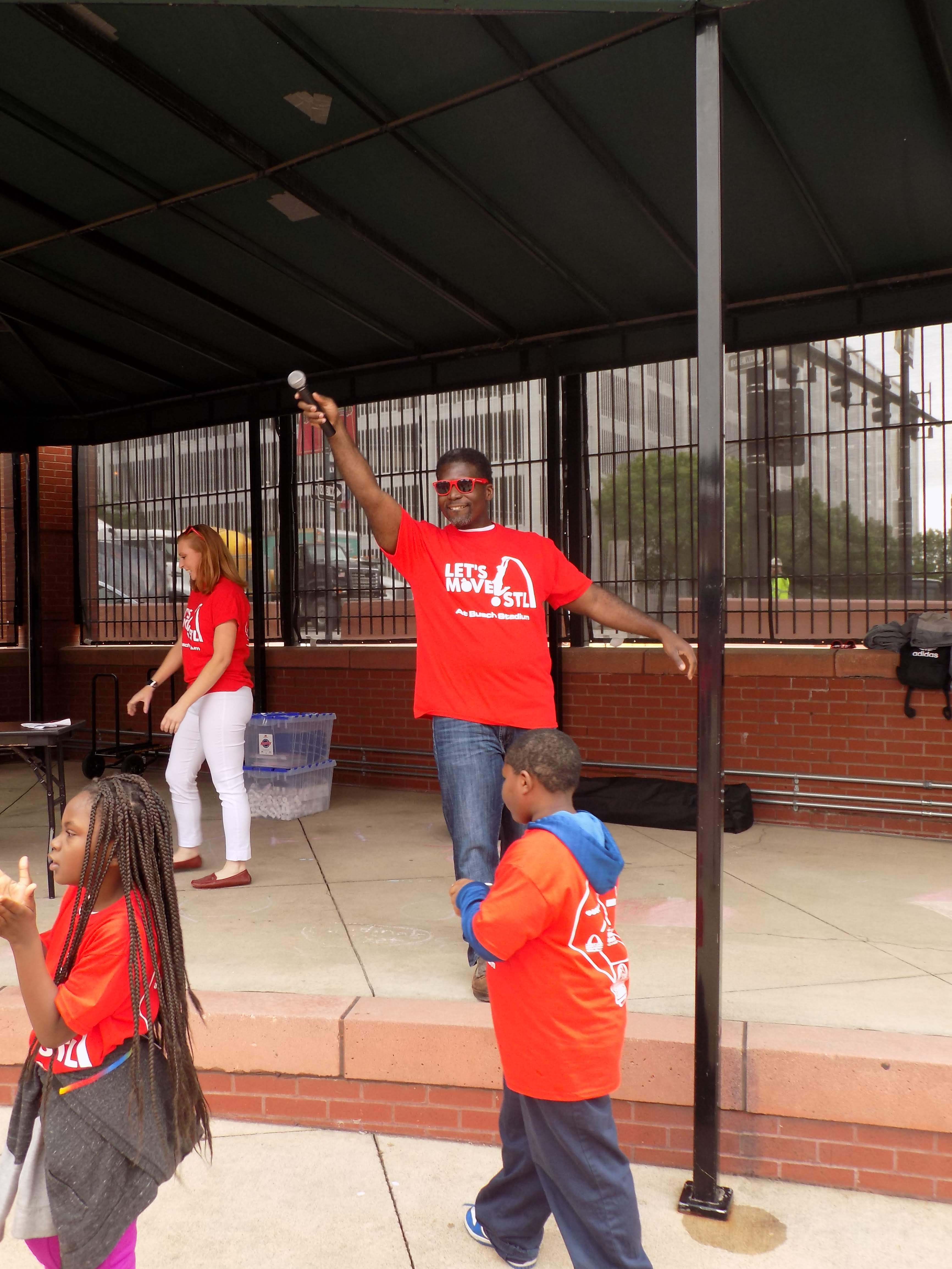 Dr. Fredrick Echols, director of health for the City of St. Louis, encourages the crowd to keep moving!