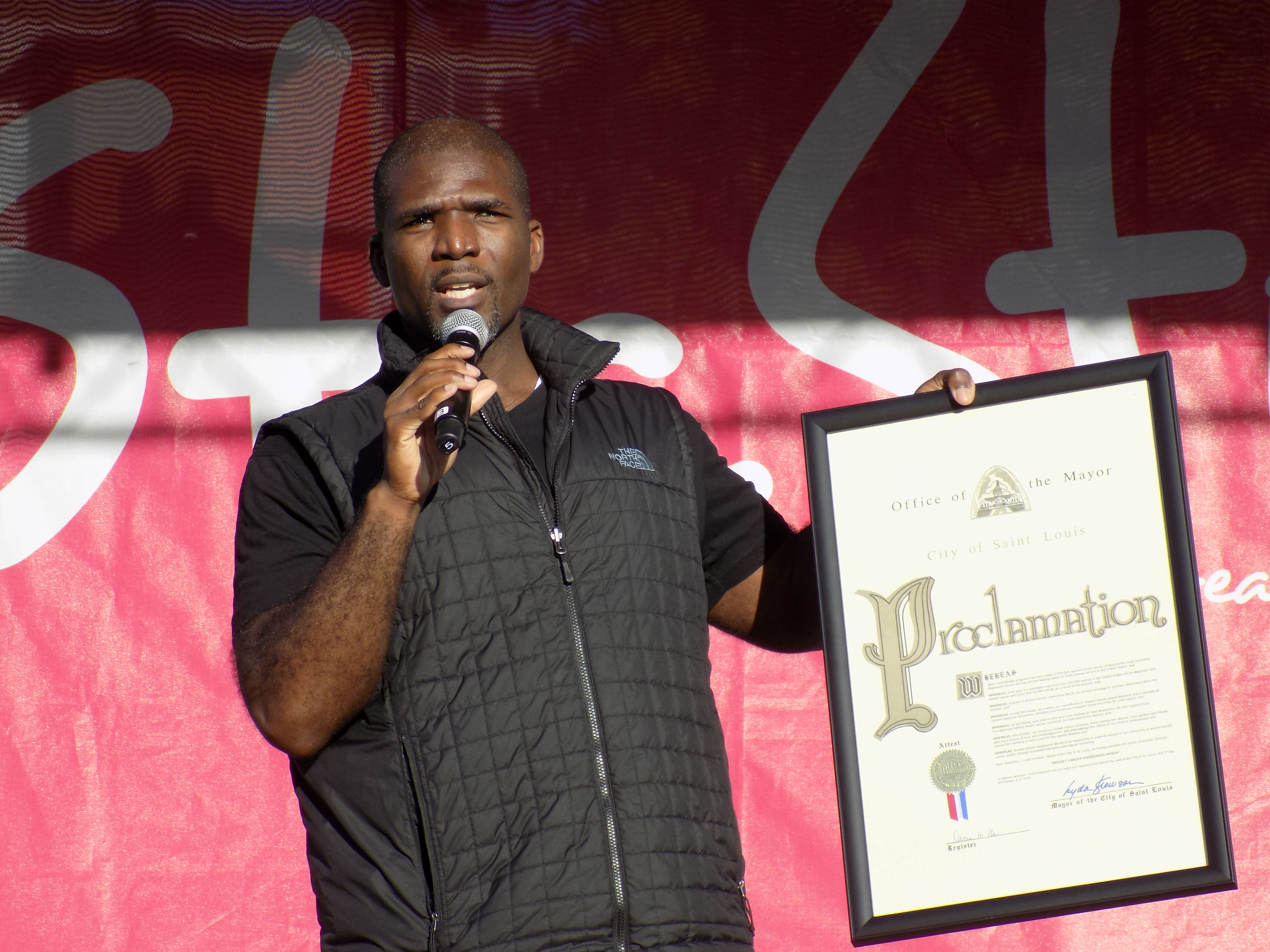 Dr. Fredrick Echols presents a proclamation for Breast Cancer Awareness Month