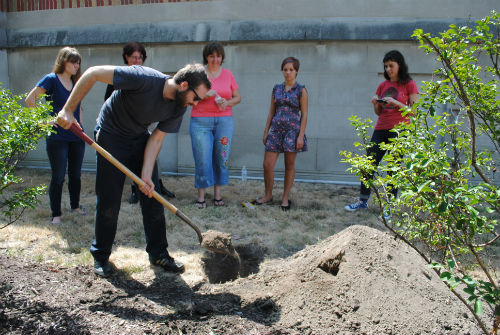 covering time capsule with soil