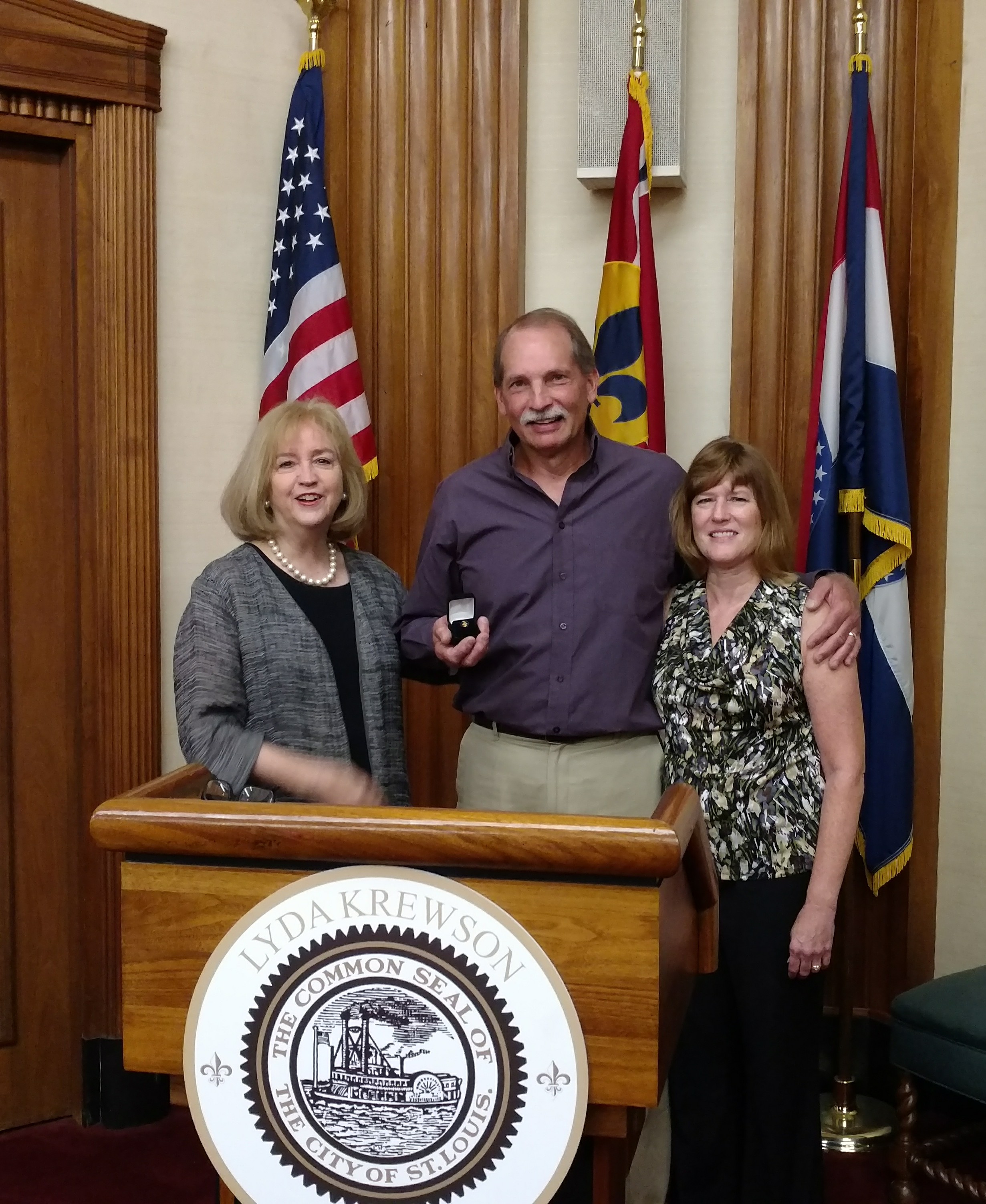 Pictures are Mayor Lyda Krewson, David Arcipowski and Debbie Arcopowski