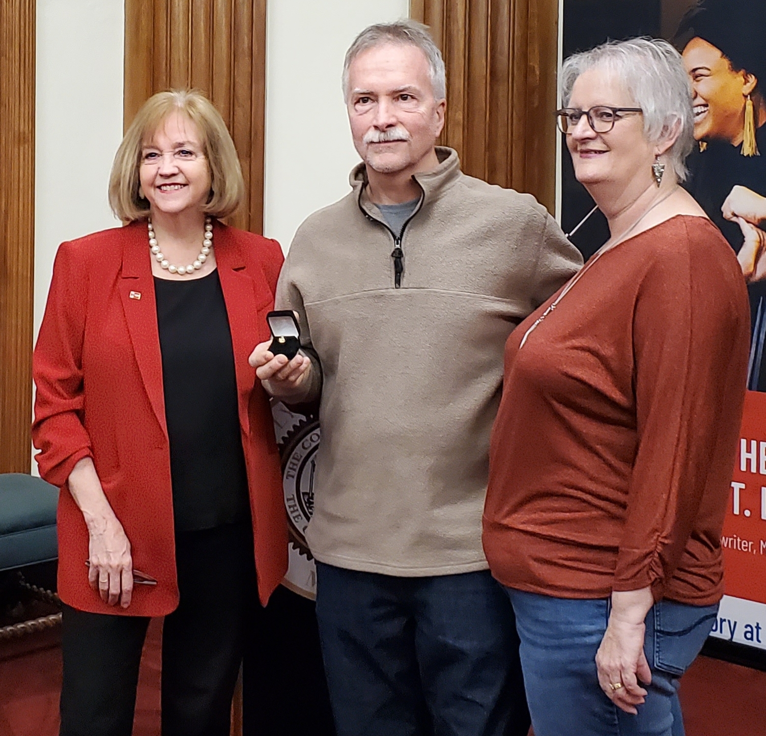 Pictures from left:  Mayor Lyda Krewson, Mitchell and Debbie Mitchell