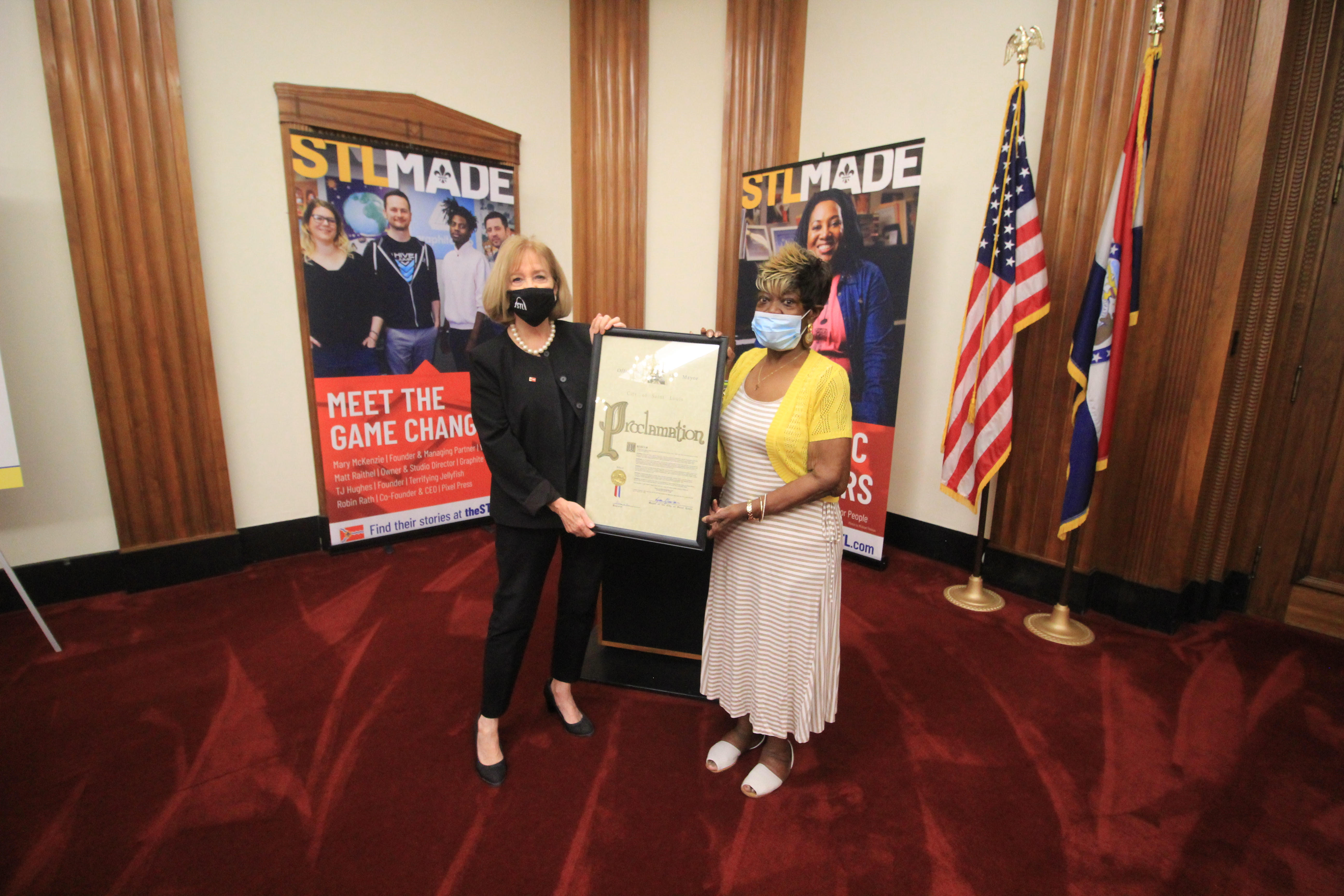 Mayor Krewsn presents a proclamation to Phyllis Keeton-Moore 