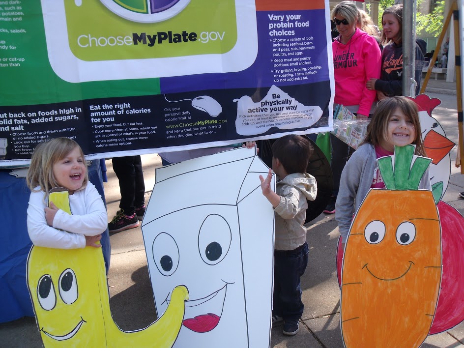 Young St. Louis residents enjoying Health Dept booth at 2015 Earth Day celebration