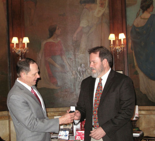 Mayor Slay presents 40-year service pin to John Stacy. 