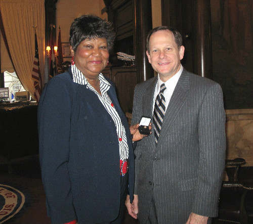 Melinda Coburn and Mayor Slay 40 yr pin 121611