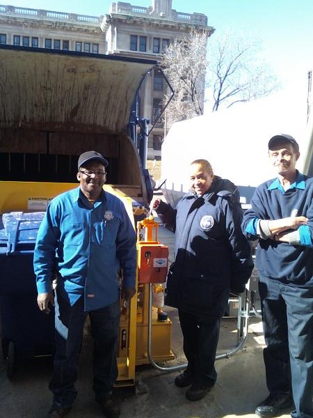 Victor, Rachel and Ron check out the new recycling equipment