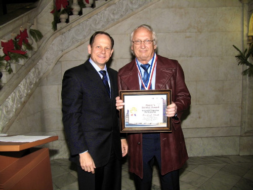 Mayor Francis G. Slay presents a Mayor's Service Award to Manfred Klatt of the Water Division.